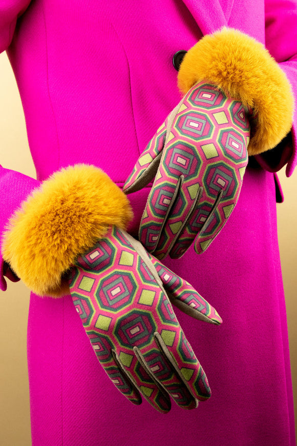 Voluptuous Vintage's Bernadette Gloves - Mustard Mosaic Gloves by Powder. A bold geometric pattern in mustard, hot pink and green covers the body of the glove. Bright mustard faux fur cuffs top the ensemble off.