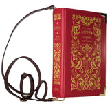 Voluptuous Vintage's Emma Book Crossbody Handbag Bag by Well Read Company. A classic hardback style book with filigree gold detailing on a dark red background. The straps attach each end of the "spine" 