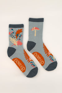 Foraging Ankle Socks - light blue socks with gorgeous whimsical illustrations of leaves, flowers and mushrooms, with dark blue toe, heel and cuff