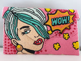 Voluptuous Vintage's Hand Beaded Luxury Pop Art Clutch Bag - Wow Bag by Rikki. A very pop art/Roy Lichtenstein image of a woman's face and a "Wow!" speech bubble/star. The background is a glorious beaded marvel in pinks, reds and yellows. 