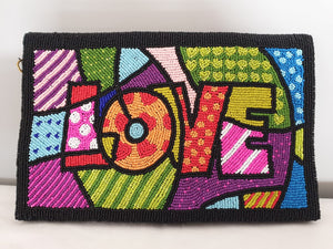 Voluptuous Vintage's Hand Beaded Luxury Pop Art Leather Clutch Bag - "Love" Bag by Rikki. A multicoloured patchwork effect fully beaded rectangle with "LOVE" depicted in multiple colours and patterns, with a black beaded border. 